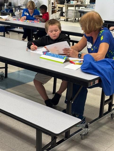 student with a reader